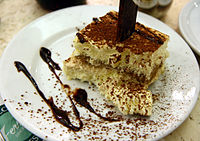 Tiramisu with cholocate sauce at Ferrara in Little Italy, New York City.jpg
