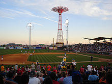 The baseball field inside the MCU Park baseball stadium. The Parachute Jump is behind the stadium.