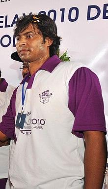 National Hockey player, Shri Dilip Tirkey holding the Queen’s Baton 2010 Delhi, at Jamshedpur on August 08, 2010 (cropped).jpg