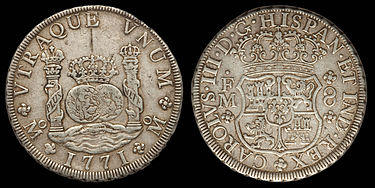 A silver coin depicting pillars, a globe and a coat of arms
