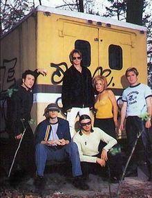 New Radicals promotional photo, featuring Alexander (second from left) and Brisebois (second from right) plus members of their touring group