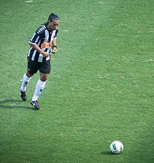 Footballer preparing to kick a ball