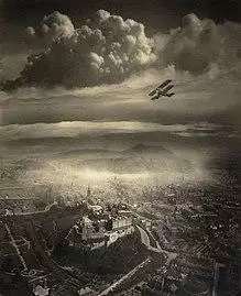 An aerial photo of Edinburgh with an aeroplane visible