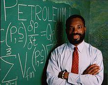 Philip Emeagwali with scribbled Exxon-Mobil equations.jpg
