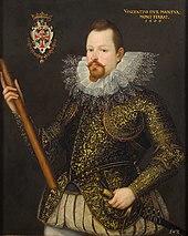 Artist's representation of a man with pointed beard, heavy ruff collar and embroidered jacket, holding a staff in his right hand and a sword in his left. A badge or coat of arms is shown top left, and a legend: "Vincentius Dux Mantua, Mont Ferrat 1600" is visible top left.