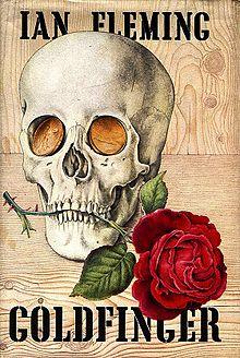 Cover showing a rose held in the teeth of a skull with gold coins for eyes. At the top is the name "IAN FLEMING"; at the bottom is "GOLDFINGER".
