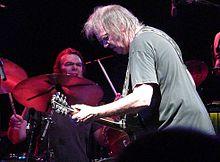 Cromwell performing live with Neil Young, in 2009.