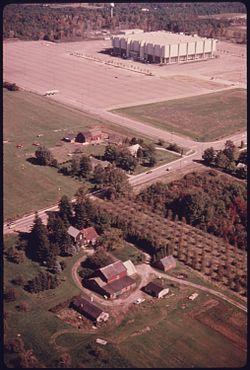 AERIAL VIEW OF THE COLISEUM BUILT NEAR INTERSTATE 271 SOUTH OF CLEVELAND, OHIO. FARMS NEAR THE STRUCTURE EVENTUALLY... - NARA - 558054.jpg