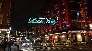 Illuminated sign above Mulberry Street at Broome Street
