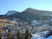 A mountain town in the distance.