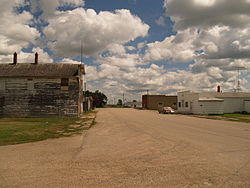 Buildings in Hamilton Hamilton, North Dakota - Pembina County Fairgrounds Hamilton, North Dakota - Wall Street (Main Street) Hamilton, North Dakota - Wall Street (Main Street) showing the 5-81 Country Bar & Grill Hamilton, North Dakota - US Post Office and Cafe Hamilton, North Dakota - Hamilton Motor and Implement building Hamilton, North Dakota - Bank of Hamilton, #1 Wall Street