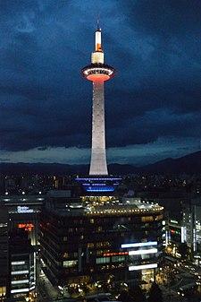 Kyoto Tower at dusk, from railway station.jpg