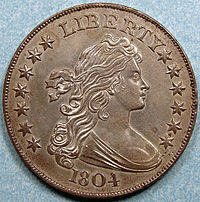 The obverse of a coin depicting an allegorical woman