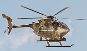 Afghan Air Force MD-530F helicopter fires machine guns.jpg