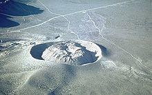 Ring of gray rock with a dome of gray rock inside it.