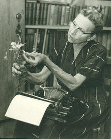 Caroline Dormon holding a flower.jpg