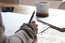 A person studying in the book.