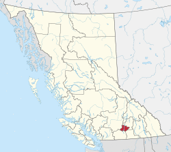 A map of British Columbia depicting its 29 regional districts and equivalent municipalities. One is highlighted in red.