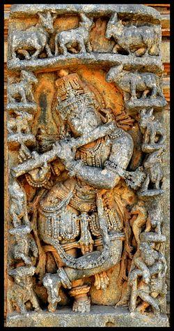 Relief of Krishna playing flute with his herd of cows in Bucesvara Temple at Koravangala.jpg
