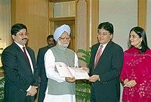 The Minister for Communication & IT Shri Dayanidhi Maran and CMD Sun Network Shri Kalanidhi Maran presenting a cheque of Rs. 5.5 crore to Prime Minister Dr. Manmohan Singh towards PMNRF for Tsunami Victims in New Delhi.jpg