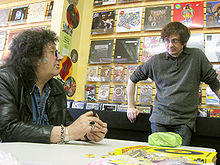 Mick Farren (left) with Patrick Boissel at the signing of the Bomp! book at Freakbeat Records in Sherman Oaks, California