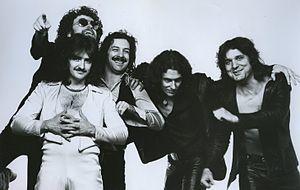 1977 publicity photo with the 1971–81 lineup, L–R: Donald "Buck Dharma" Roeser (bottom); Eric Bloom; Albert Bouchard; Allen Lanier; Joe Bouchard