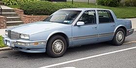 1990 Cadillac Seville, front left (Bellerose Manor).jpg