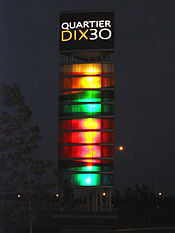 Quartier DIX30 tower night.jpg