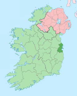 map showing County Dublin as a small area of darker green on the east coast within the lighter green background of Ireland and Northern Ireland in pink