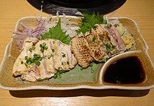Brand chicken sashimi served lightly braised as tataki. Kagoshima.