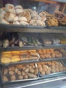 Window display of metal trays of dim sum