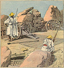 Malagasy soldiers wearing traditional white togas stand watch beside several large cannons