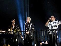 The current line up of Take That (L to R: Donald, Barlow and Owen) performing in Glasgow, Scotland in 2017