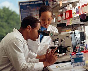 Researcher looking through microscope.jpg