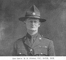 head and shoulders portrait of man in military uniform and hat
