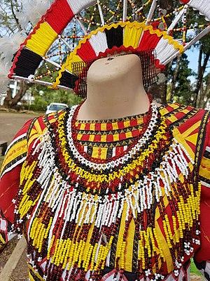 Higaonon traditional women's attire, with bali-og necklace and headdress.jpg