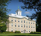 An exterior shot of a limestone, rectangular building