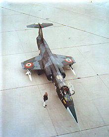 Italian F-104S parked on tarmac with underwing-mounted AIM-7 Sparrow missiles