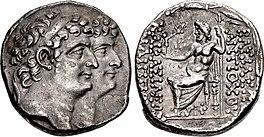 Coin minted by Antiochus XI and Philip I. The obverse depict them together with Antiochus XI appearing ahead of Philip. The reverse contain the kings' names to the right and their epithets to the left. In the middle of the reverse, Zeus is depicted sitting on a throne holding a sceptre and holding a Nike in his hand which is stretched toward the inscription of the epithets