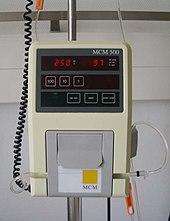 Photograph of a simple, single infusion IV pump.