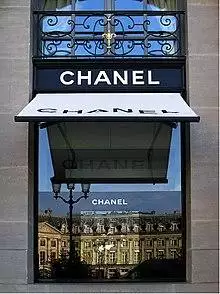 Chanel's headquarters storefront window at the Place Vendôme Paris with awning