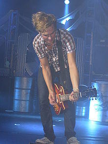 Fletcher performing on stage in 2009