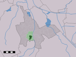 The town centre (dark green) and the statistical district (light green) of Vries in the municipality of Tynaarlo.