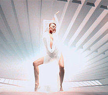 Minogue wearing a white hooded jumpsuit