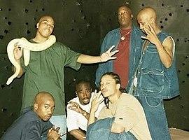 The group in 1996. Standing: Napolean, E.D.I Mean, and Fatal Hussein. Squatting: K. Kastro, Makaveli Tha Don, and Yaki Kadafi.