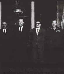 Four men in suits