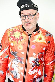 Larry Tee dressed in TZUJI