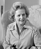 Portrait, head and shoulders, facing right.