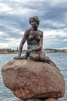 A statue of a mermaid sitting on a rock, surrounded by water. The above file's purpose is being discussed and/or is being considered for deletion. See files for discussion to help reach a consensus on what to do.