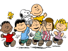 The characters from Peanuts holding aloft Charlie Brown and Snoopy.